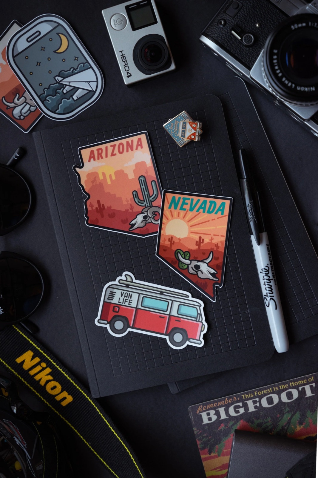 Notebook and camera setup with die-cut travel stickers