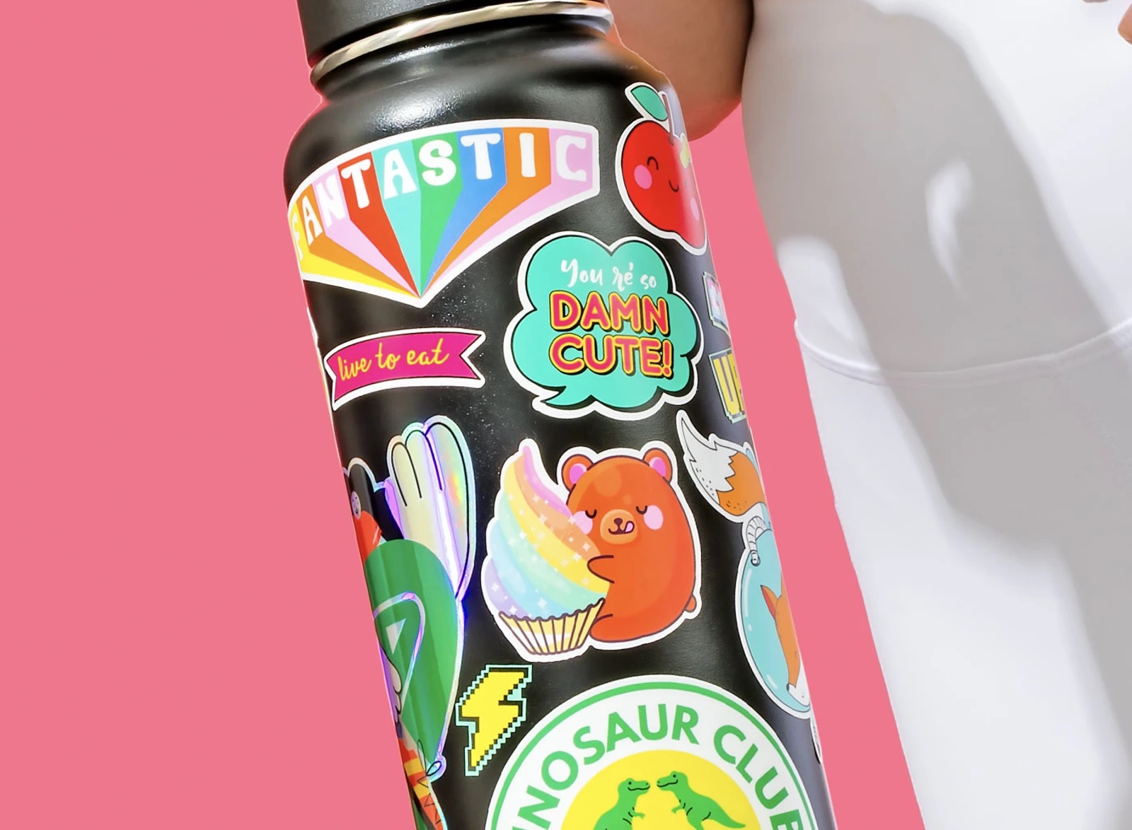Water bottle covered in colorful die-cut stickers