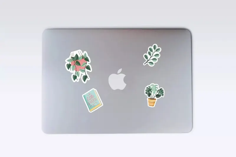 Phone and notebook decorated with colorful stickers